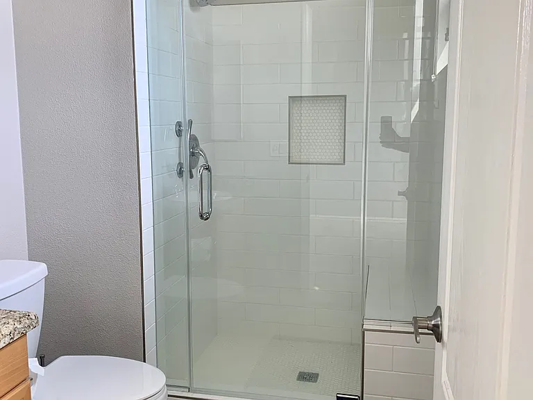 Tile shower in ensuite bathroom