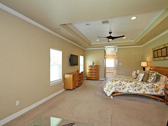 GRAND MASTER SUITE HAS SITTING AREA, CROWN MOLDING/ INSET CEILING OVER THE LIVING AREA AND LARGE ENOUGH FOR BIG FURNTIURE