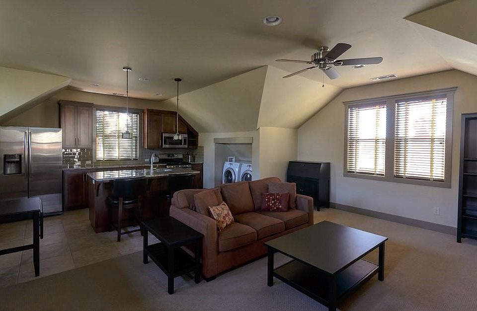 Living room and kitchen from top of stairs.