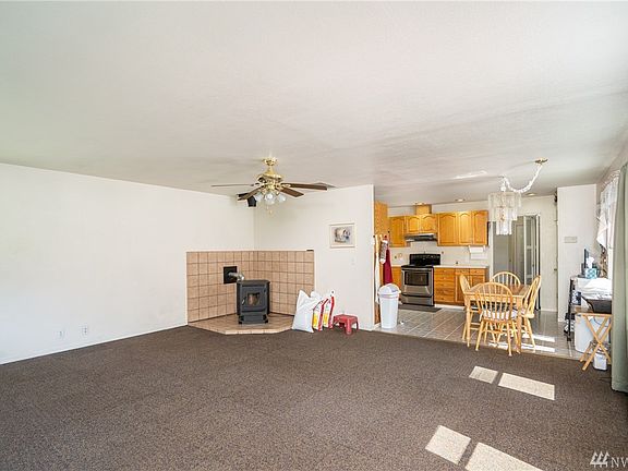 Kitchen eating space,  efficient pellet stove in corner of living room