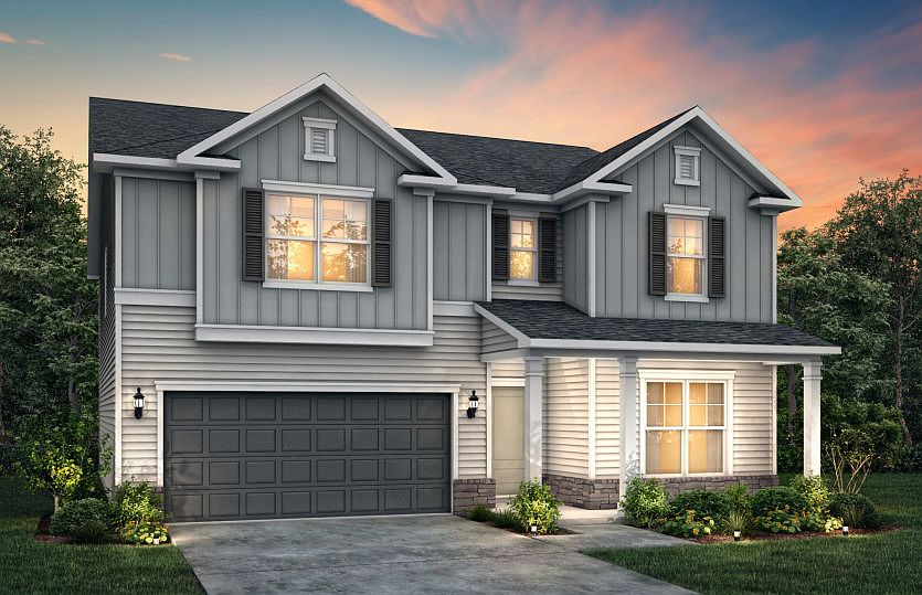 Pennington LC2H features siding, stone accents, covered front porch and 2 car garage