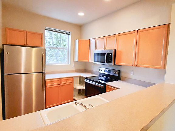 Classic kitchen with updated stainless steel appliances, lots of storage and counter top space. Plus natural light and fresh air!