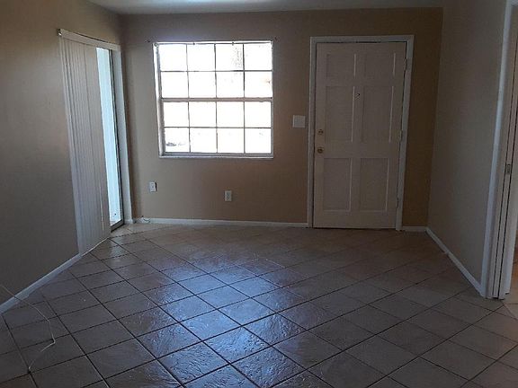 Side entry with parking pad just outside door