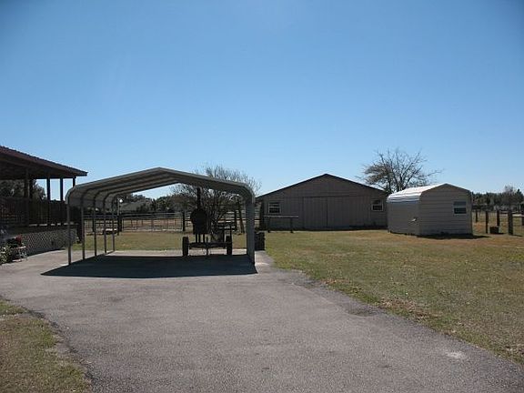 2 car carport, 3 stall barn, well/pump house