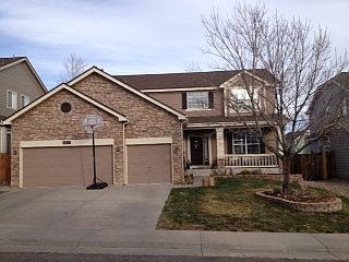 beautifully landscaped with amazing seasonal flowers and bulbs- 3 car garage  
