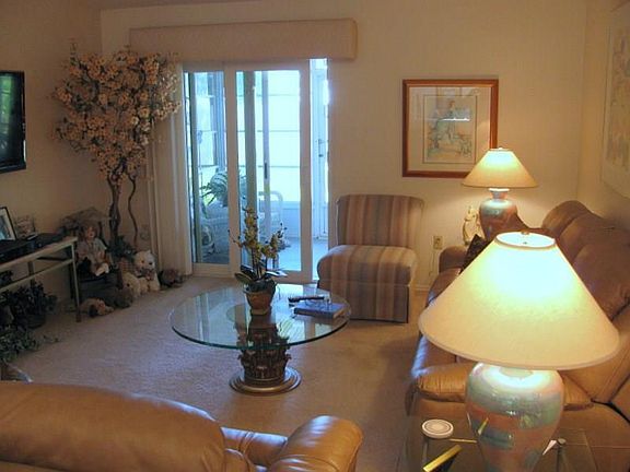 Living room.   Enclosed back porch