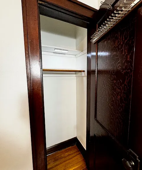 Smaller closet in primary bedroom