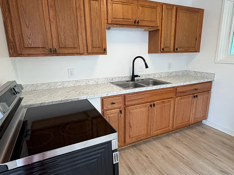Brand new kitchen stove/oven and cabinets