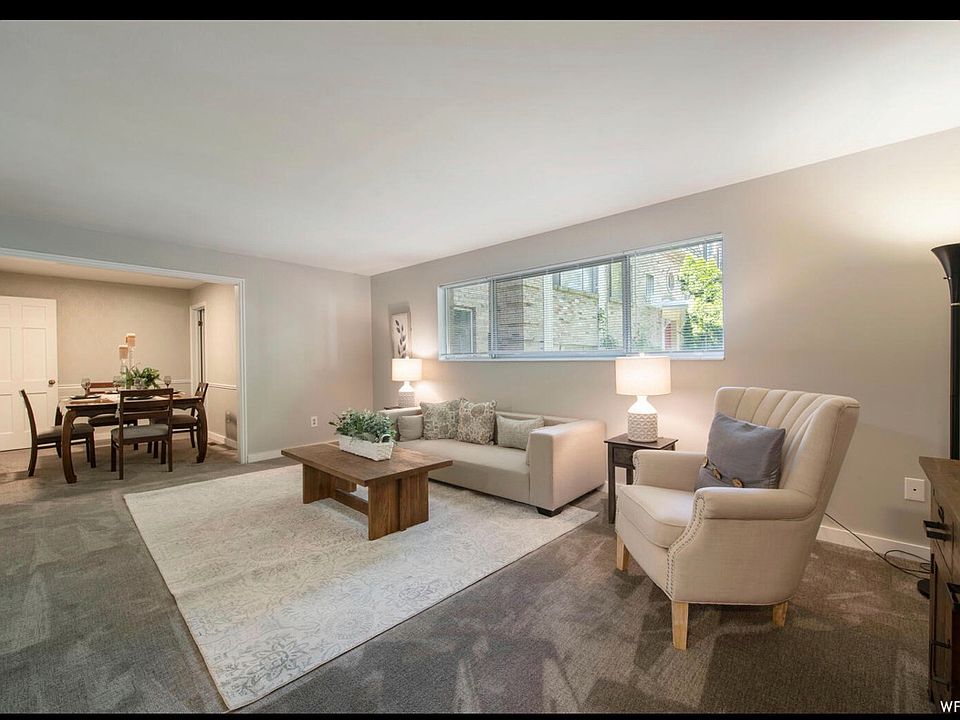 Living area with new carpets, large window