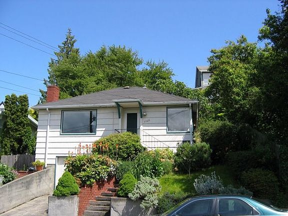 Exterior: note wooded lot to the right