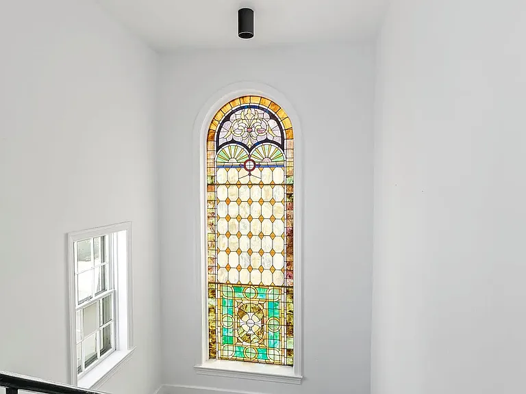 Original stained glass window in stairwell from 1860's