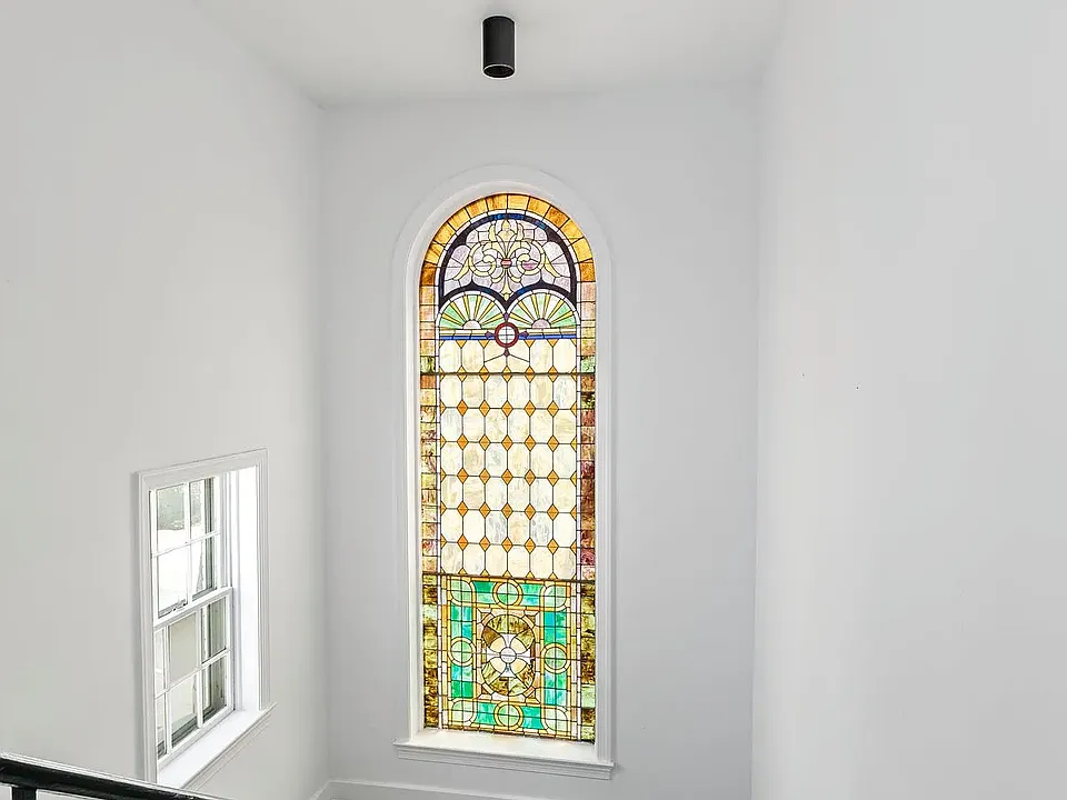Original stained glass window in stairwell from 1860's