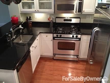 Kitchen
						:
						GE Stainless steel appliances and black granite counter tops