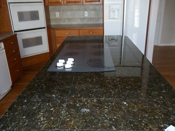 Granite island with cook top
