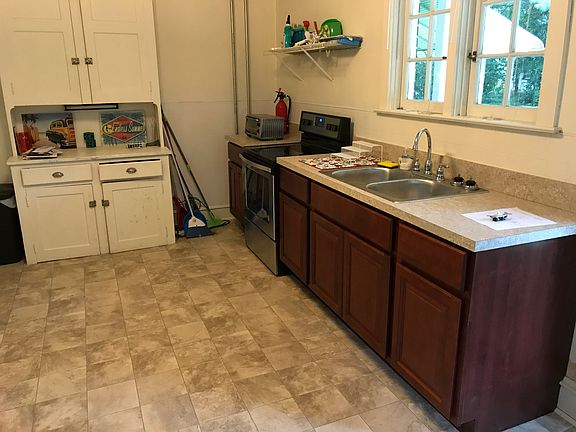 Kitchen view with pantry that can be used for food storage and small appliance storage or a coffee bar.