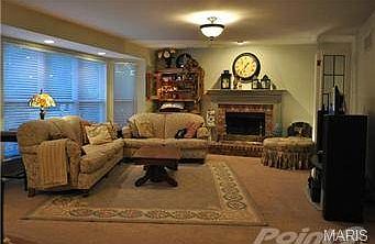 Hearth Room:  Generous size, wood burning fireplace, bay window