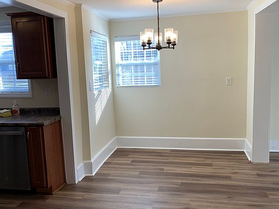 Spacious dining area between kitchen and living area.