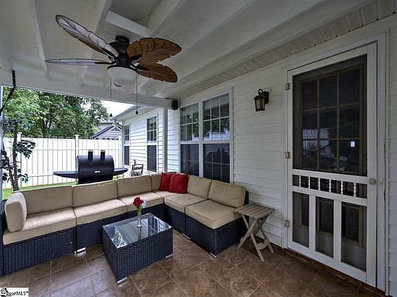 Covered Porch with Tiles and Ceiling Fan