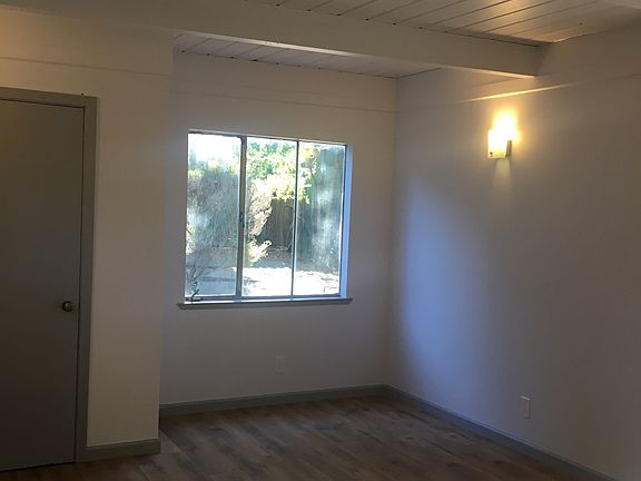 bedroom 1 can easily fit a cal king bed/ 1 connects to enclosed patio over looks backyard