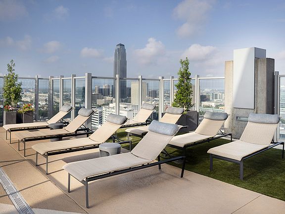 Pool deck lounge seating, BBQ grills and dining areas available