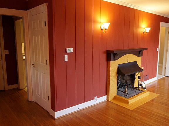 Living room showing fireplace, front door and door to large closet