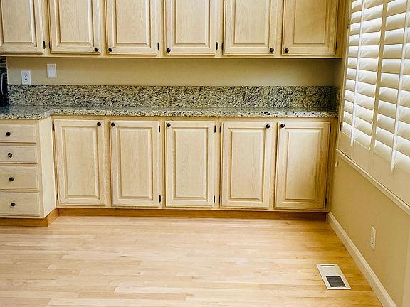 Newly done hardwood floors with no stains or damage. Clean cabinets throughout. Lots of storage in kitchen area.