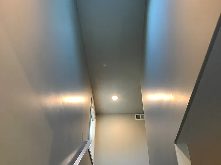 Skylight above staircase going to top floor with 2 bedrooms
