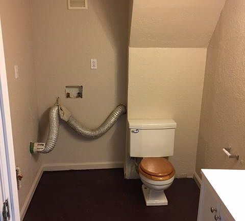 basement half bath with laundry