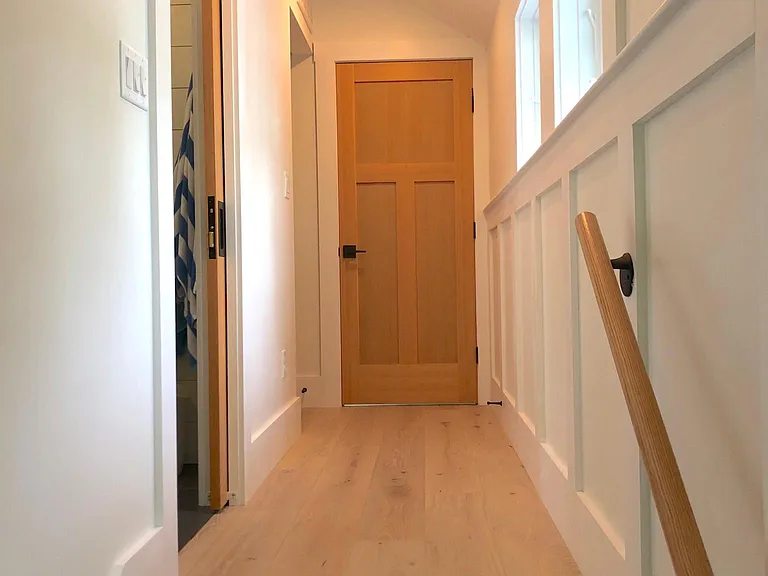 Upstairs hall. Master bath on the left, walk-in closet next and master bedroom at the end of the hall.