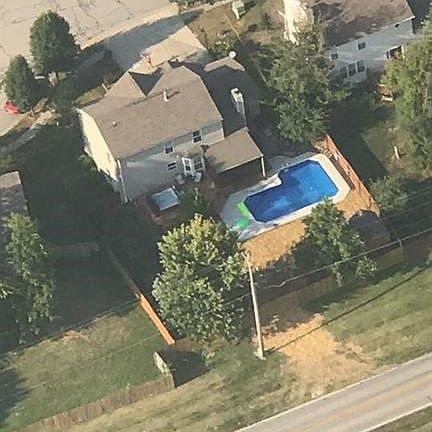 Aerial view of 1271 Elm Grove Lane. Notice the fully fenced backyard.