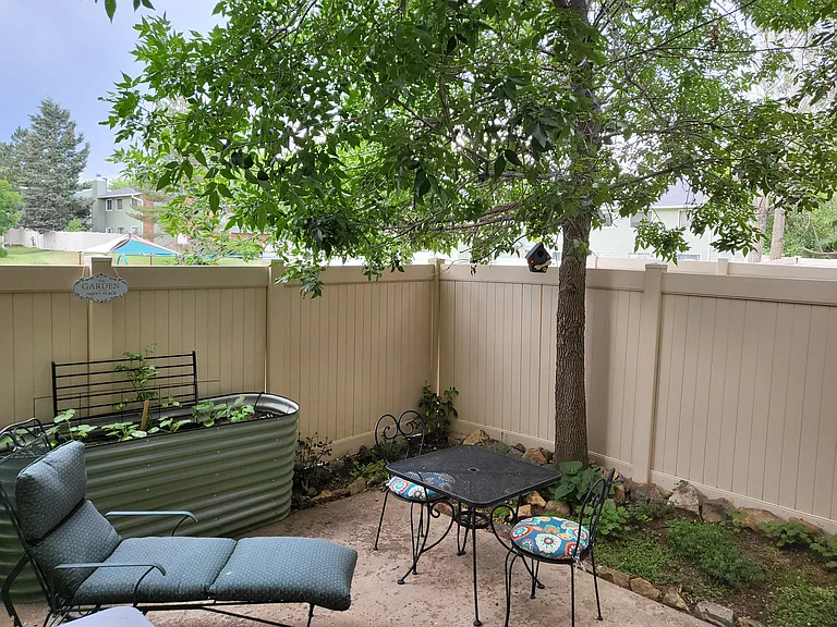 Shared, dog friendly, fully fenced in patio, w/raised vegetable garden beds.