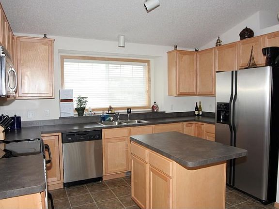 Gourmet Kitchen with center island, Maple cabinets, and Stainless appliances