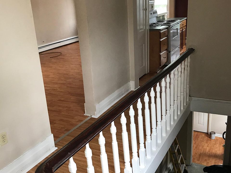 View from the top of the steps, into the kitchen & down to the front door .