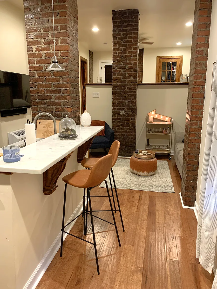 Marble countertops, bar seating open to living room - 742 Monroe Dr NE #19