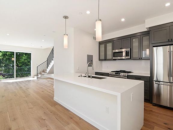 Open floor plan; kitchen / living / dining area