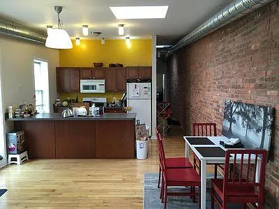 Previous dining area and kitchen and skylight.
