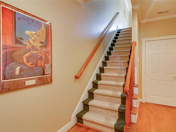 Spacious foyer with hardwood floors.