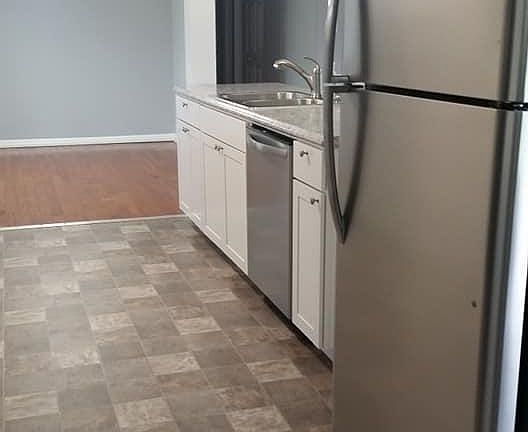 Galley kitchen with dining area
