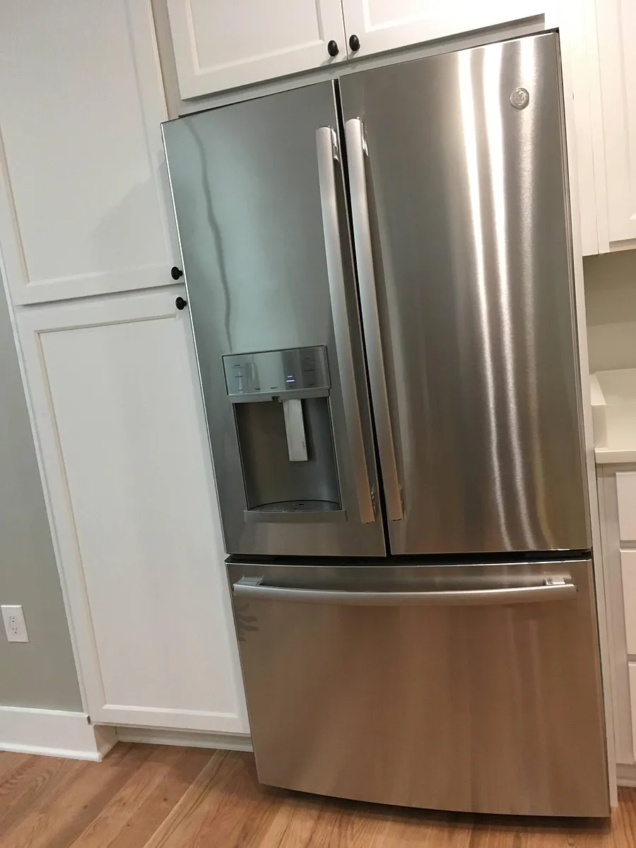 French door refrigerator with drinking water and ice dispensers on the outside of the door. Freezer below - 2634 39th St NW #3
