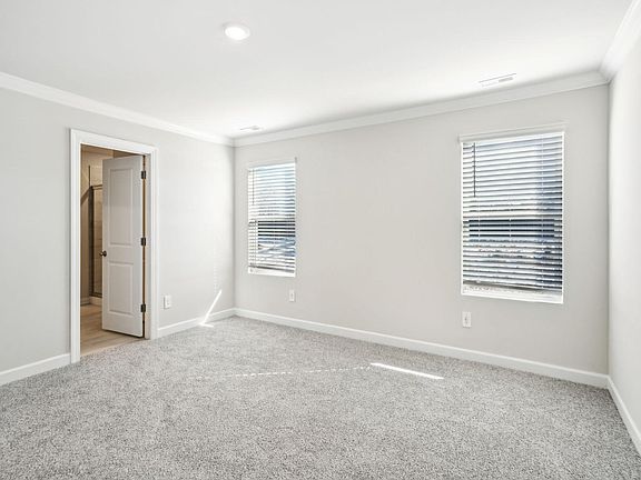 The primary bedroom conveniently leads to your private bathroom.