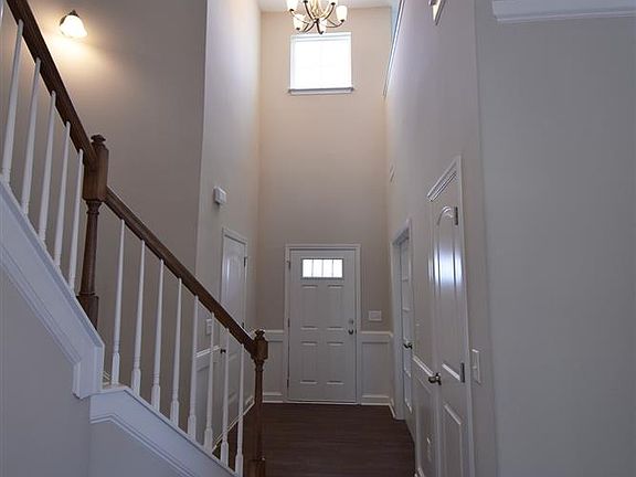 Grand two story foyer with chandelier