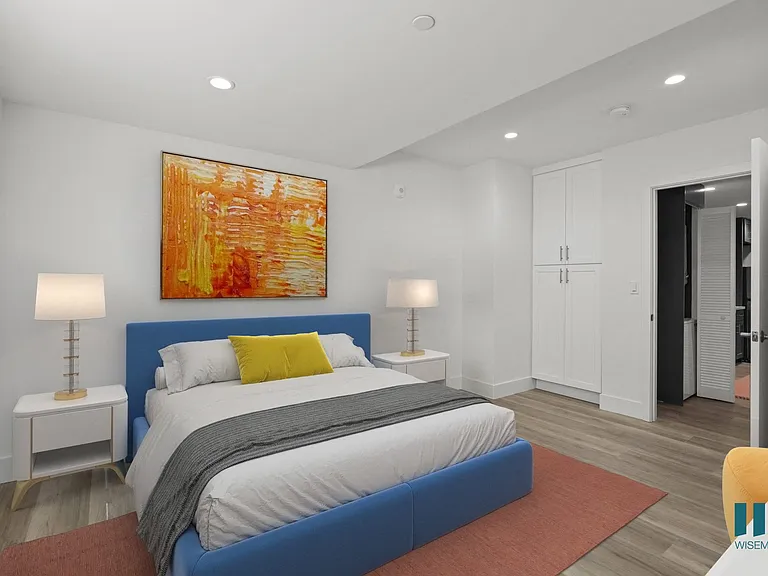 Bedroom with Built-In Cabinet Storage and Vinyl Flooring