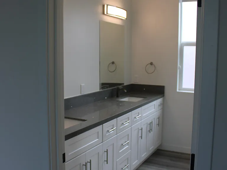 looking into bathroom from primary bedroom