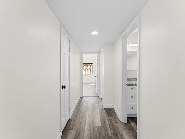 Hallway to guest bathroom - leads to 2 bedrooms on 1st level of home