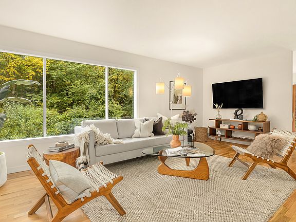 Front tiled entry leads to living room with hardwood floors.