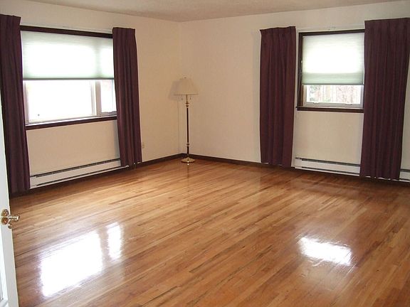Spacious Living Room With Fireplace & French Doors
