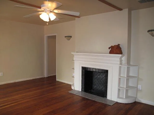Large living room with mock fireplace