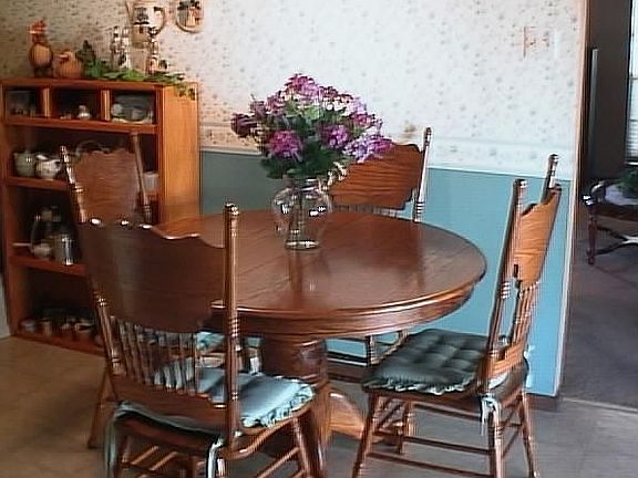 Breakfast area with view of beautiful landscaped backyard!