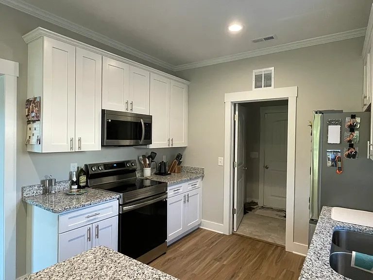 Kitchen. View into mudroom/laundry room.