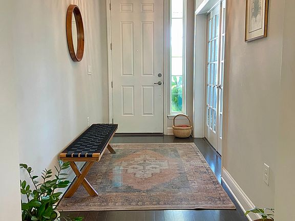 Bright and welcoming entry. French doors lead to home office or bonus room.